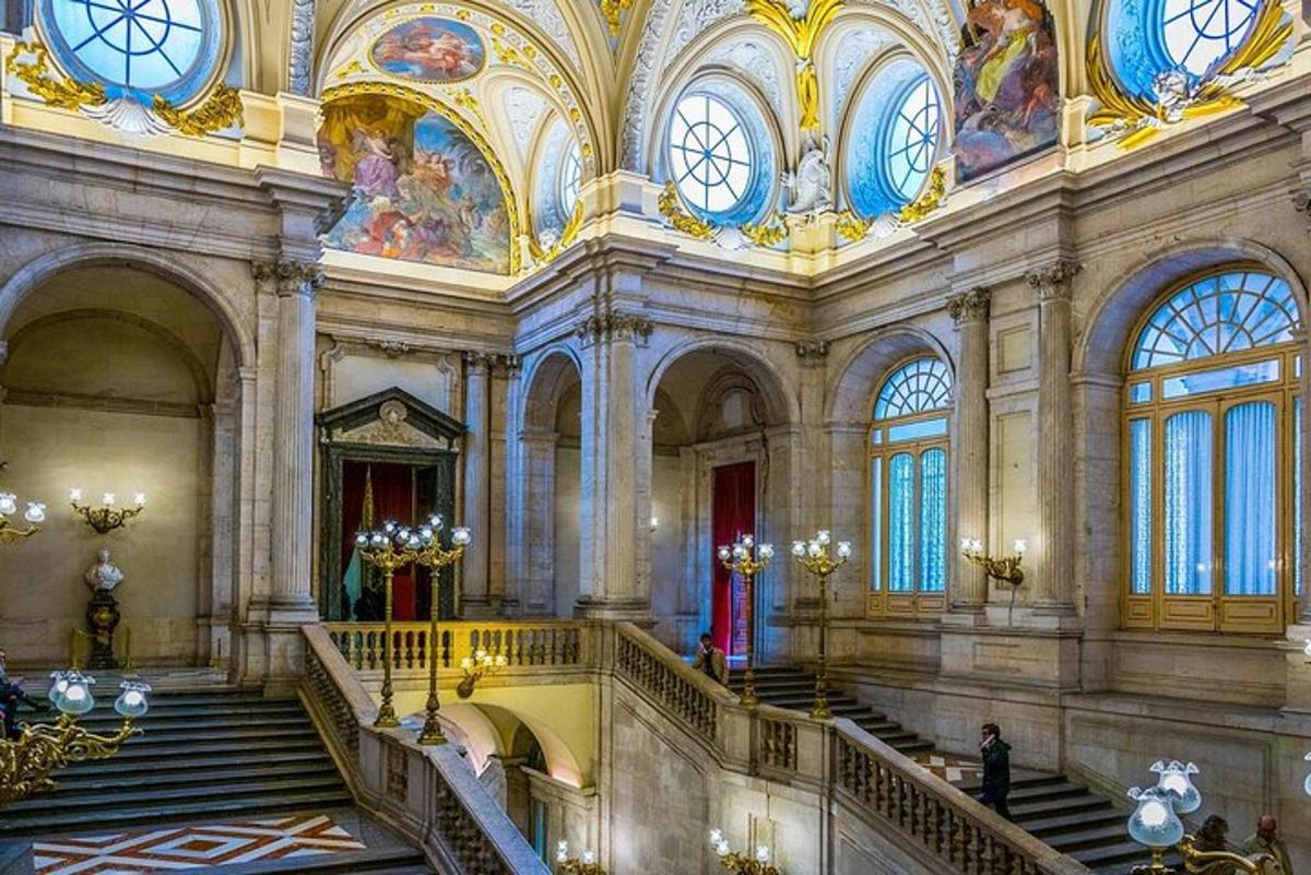a large building with stairs and ceilings and windows