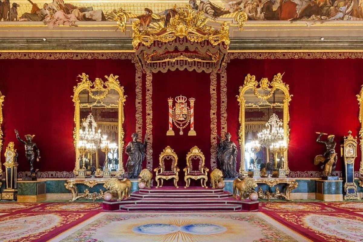 a room with red walls and gold decorations