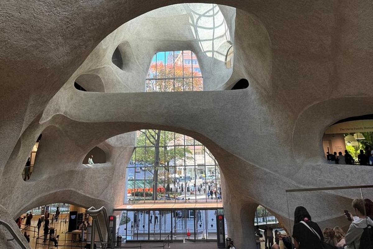 a view of a building with people walking in it