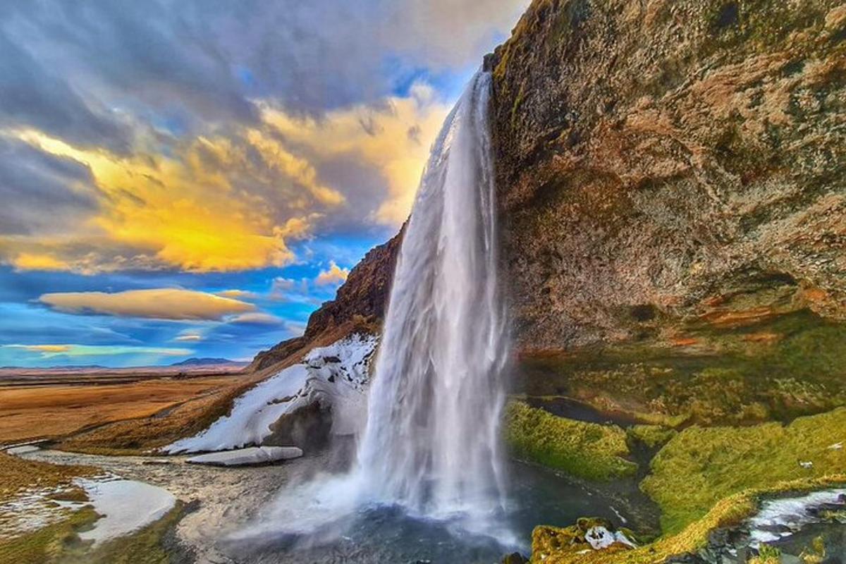 a waterfall on the side of a mountain