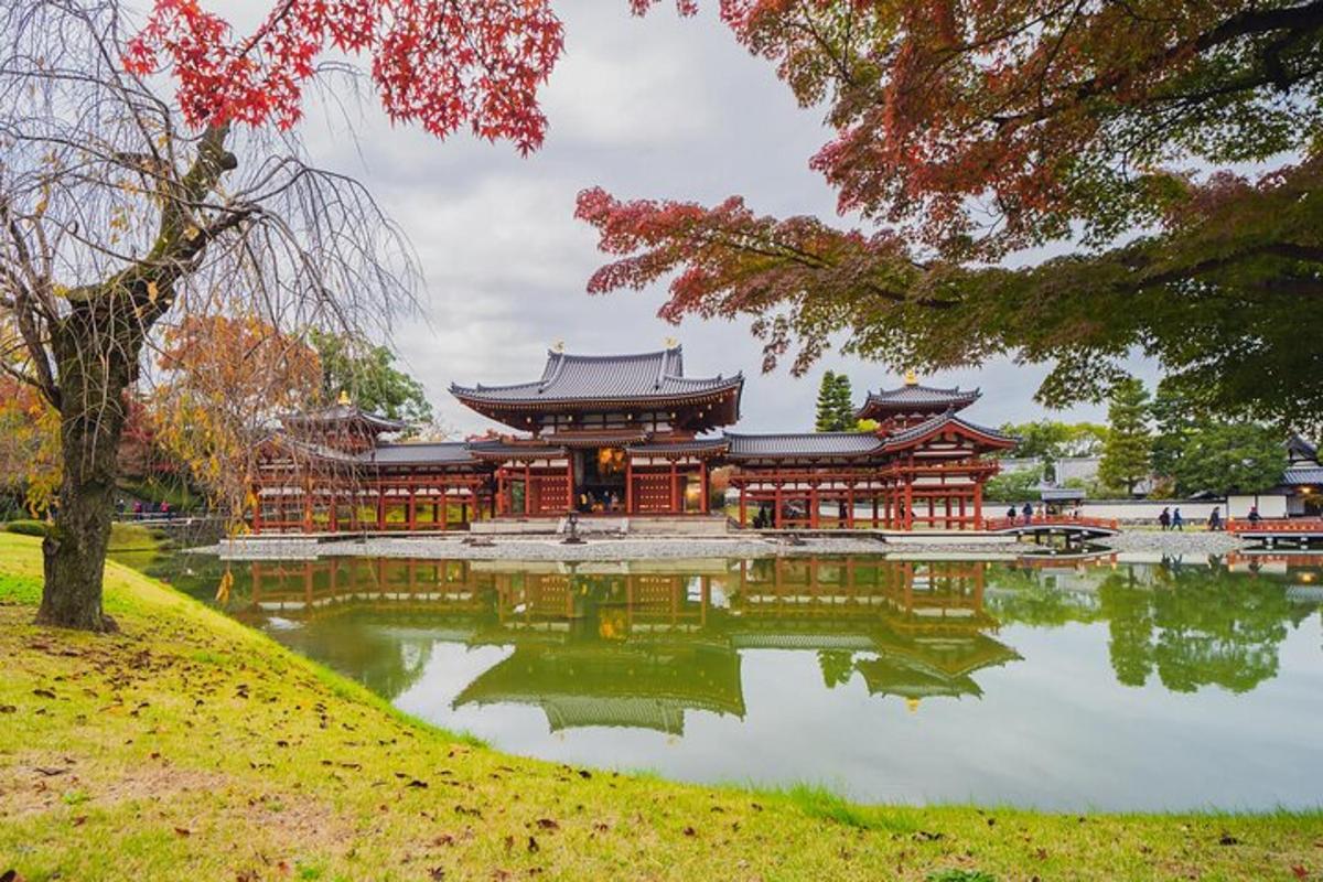 a temple with a pond in front of it