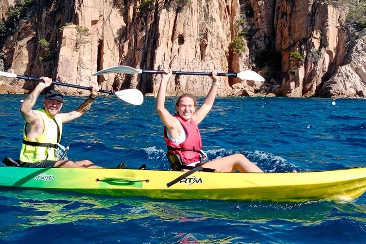 two people on a kayak in the water