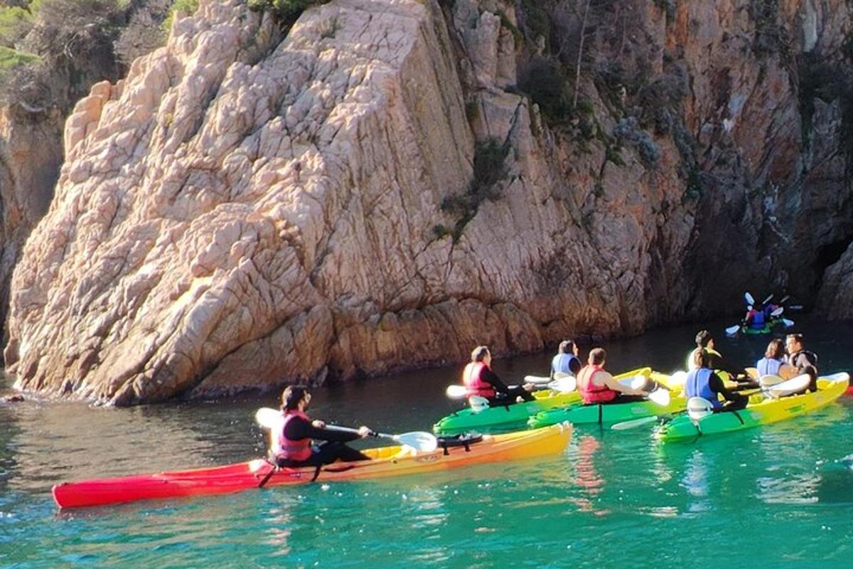 a group of people in kayaks in the water