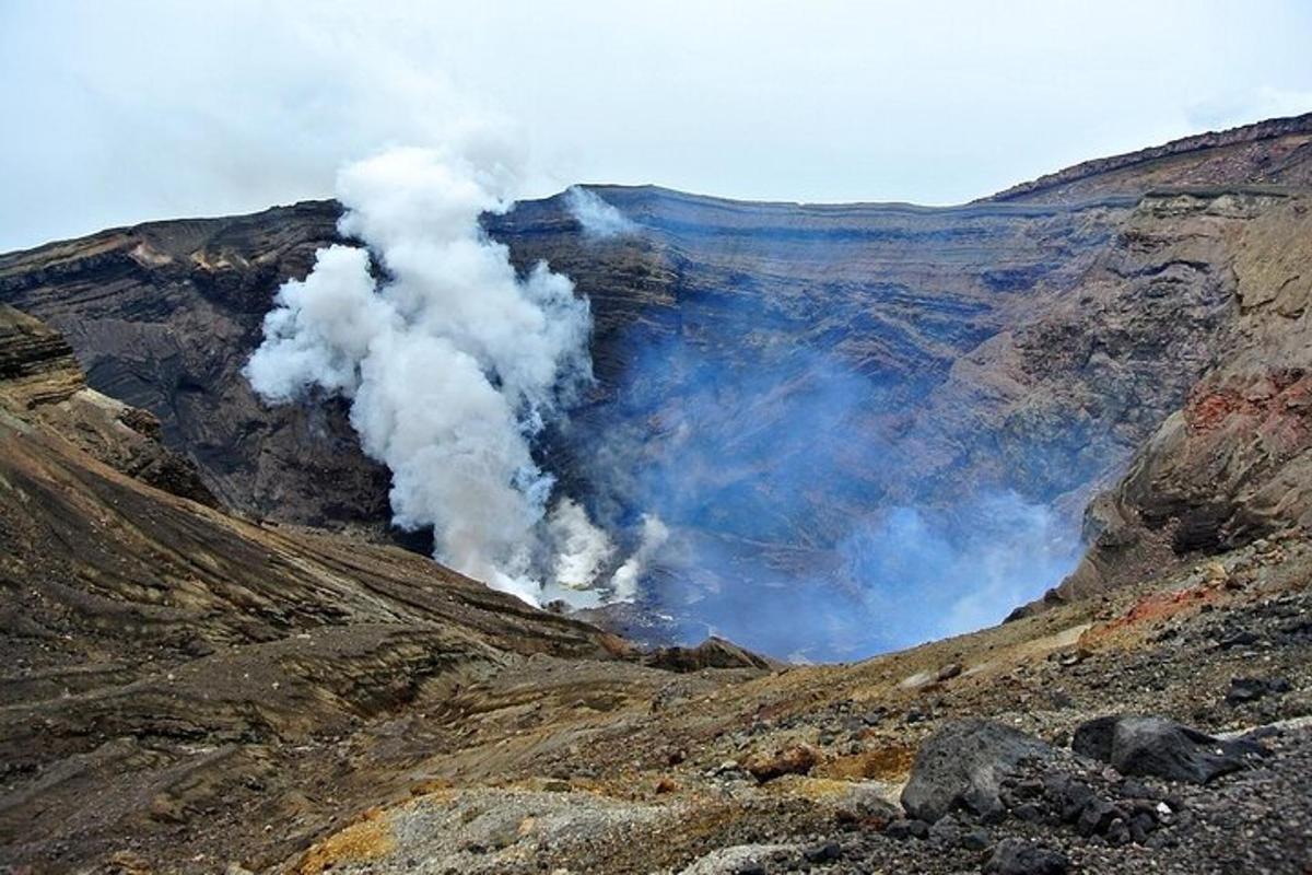 a bunch of smoke coming out of a mountain