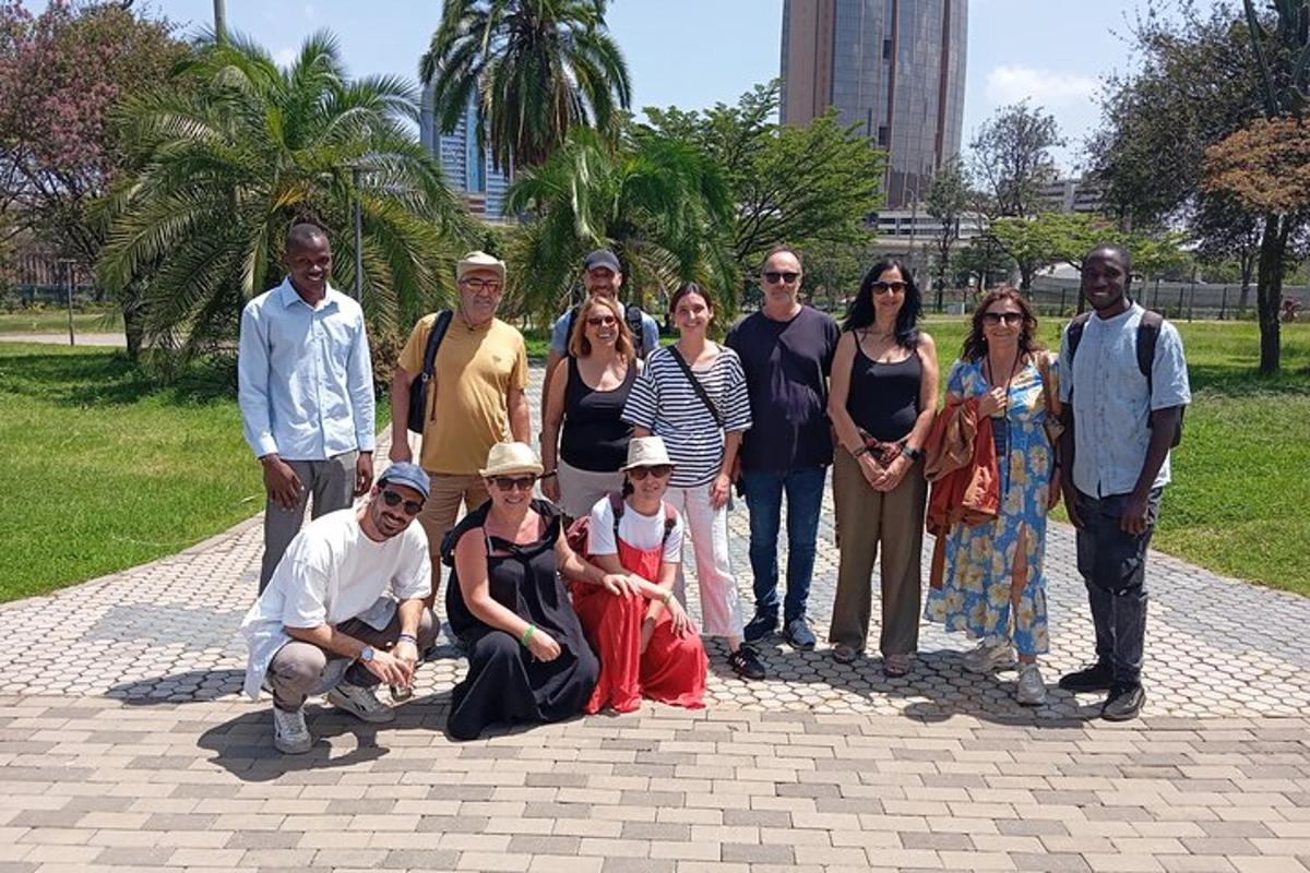 a group of people posing for a picture in a park