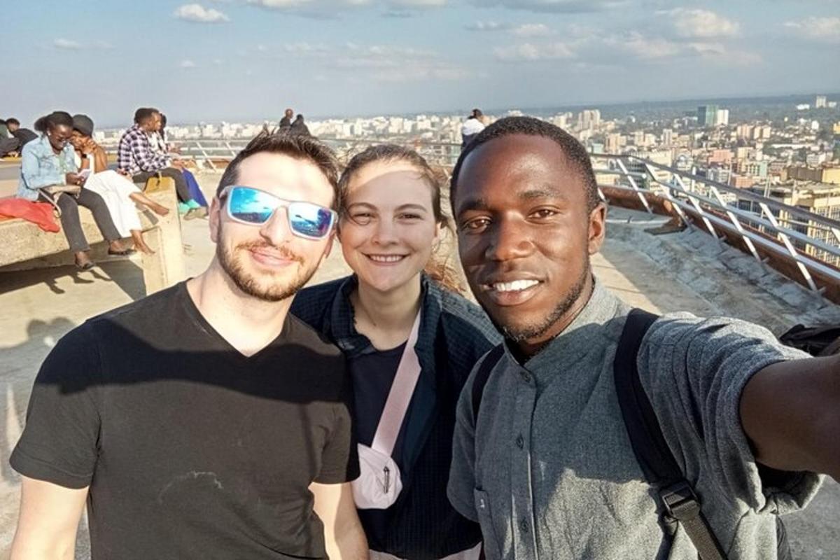 a group of three people posing for a picture