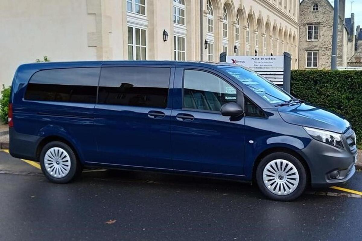 a blue van parked in a parking lot