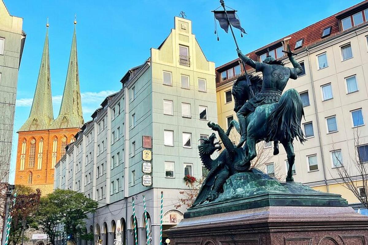 a statue of a woman holding a flag in a city