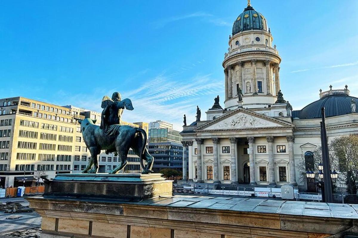 a statue of a man on a horse in front of a building