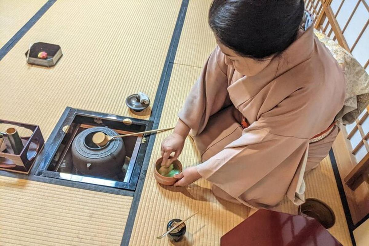 a woman sitting on the floor with a bowl of food