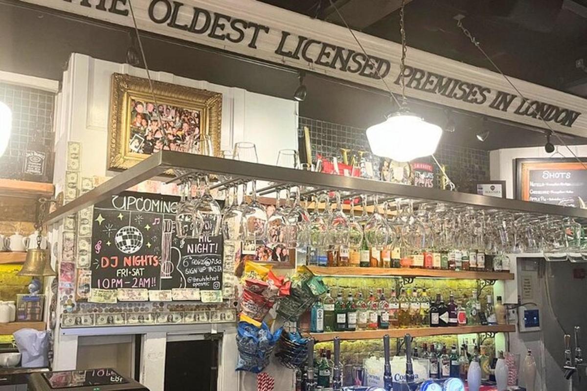a bar with a lot of glasses on a shelf