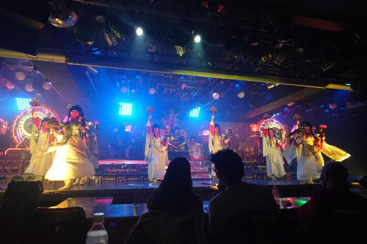 a group of people watching a show on a stage