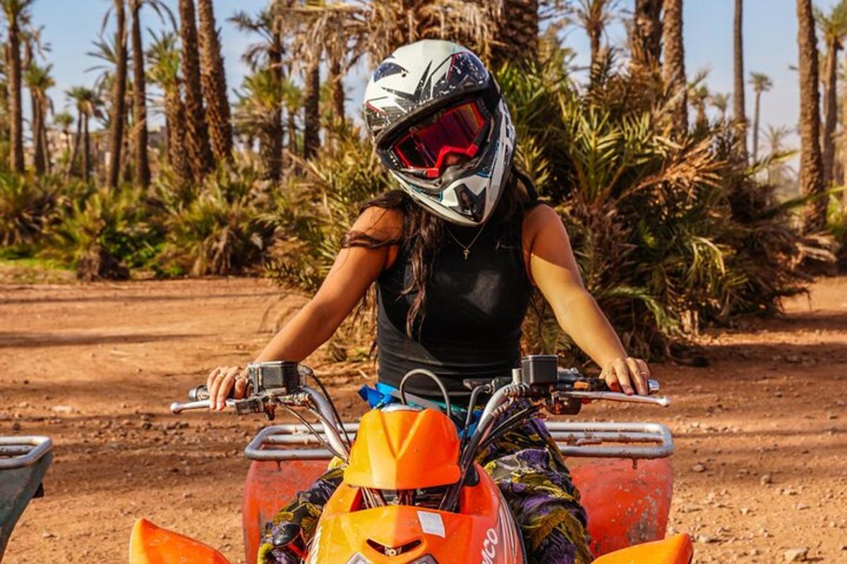 a woman riding a dirt bike with a helmet on