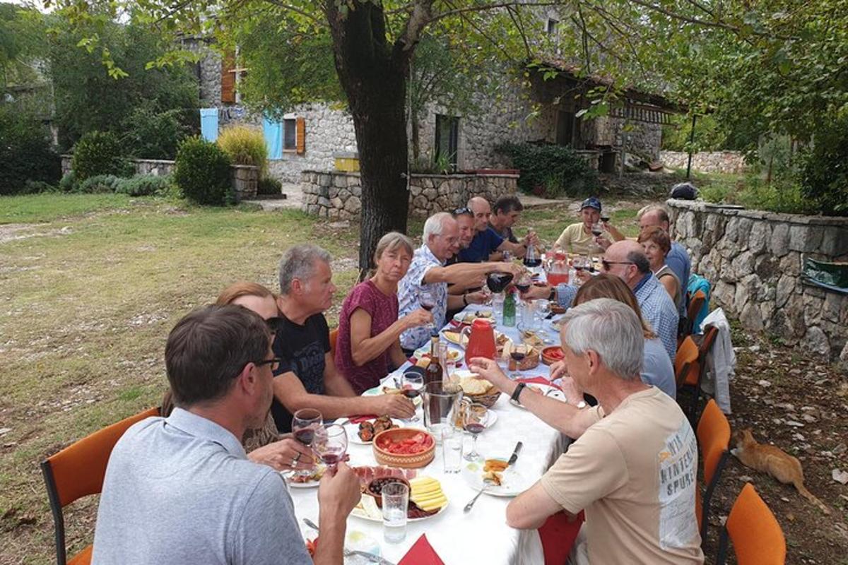 a group of people sitting at a table eating food