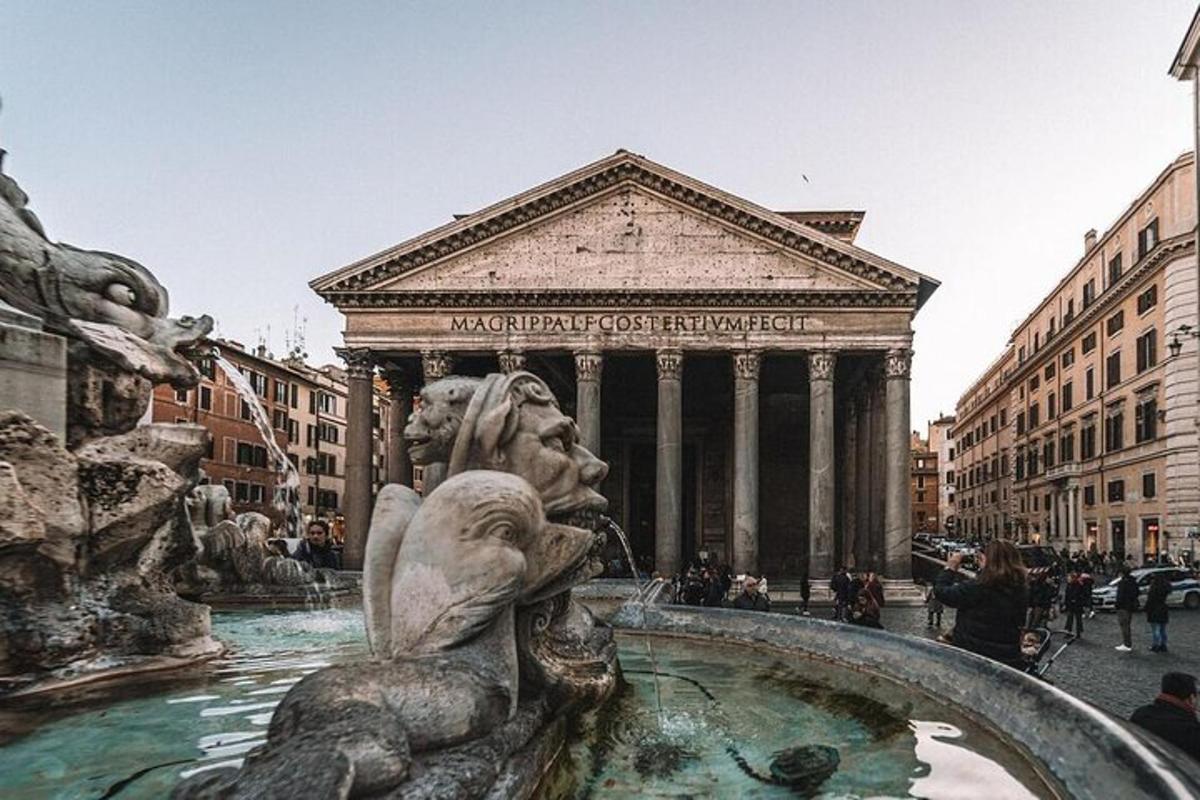 a fountain with a statue in front of a building