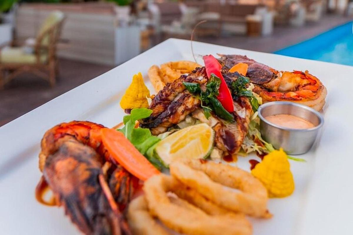 a plate of food with seafood and vegetables on a table