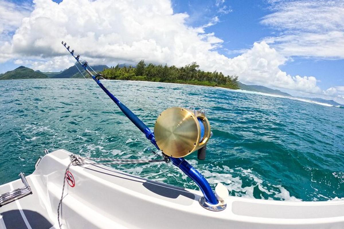 a boat with a bell on the side of the water