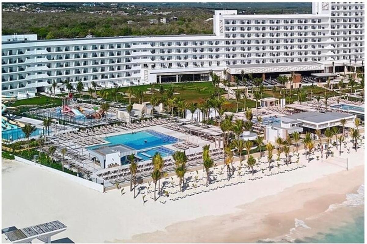 a rendering of a resort with a pool and a beach