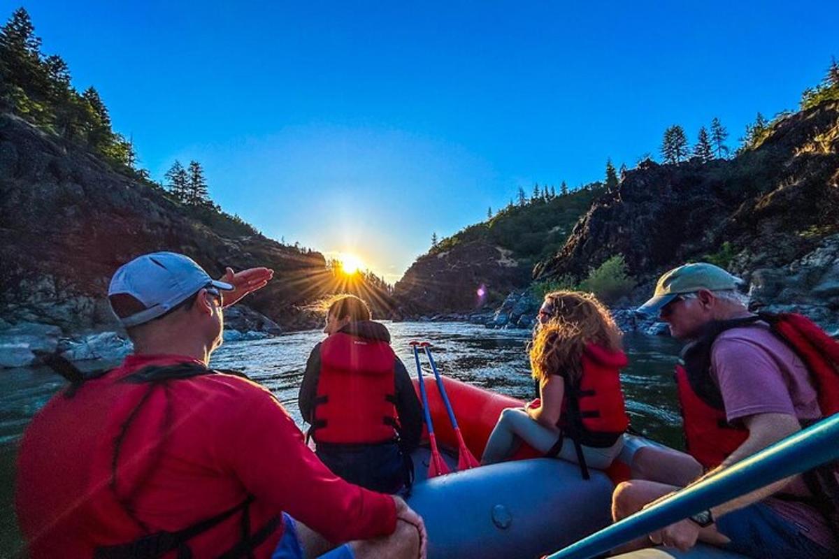 a group of people on a raft on a river