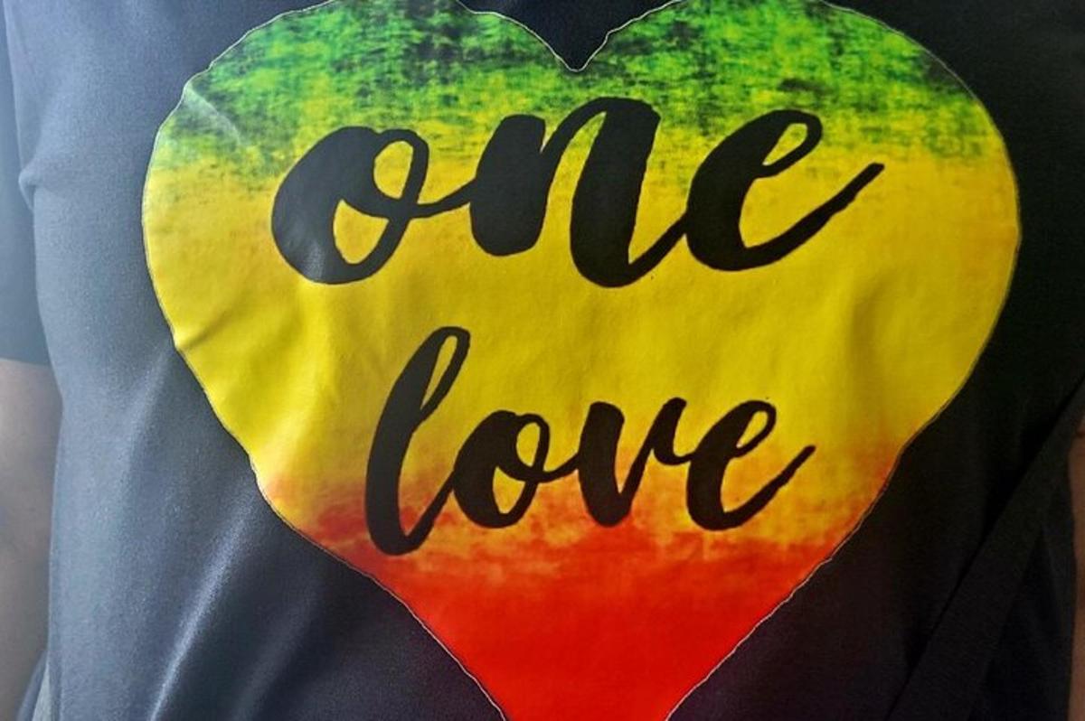 a tie dye shirt with the words cute love