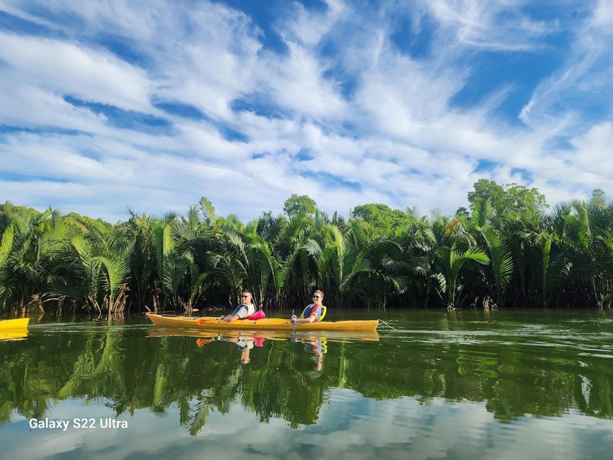two people in a kayak on a body of water