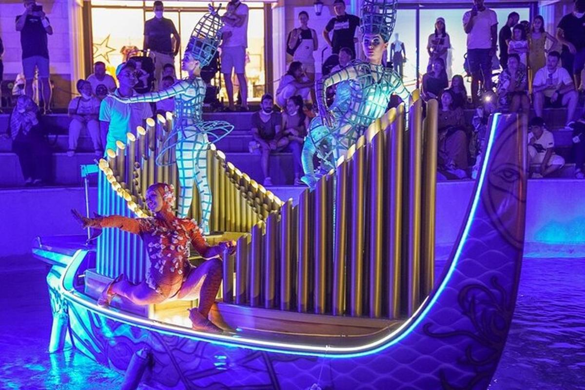 a man sitting on a slide at a party