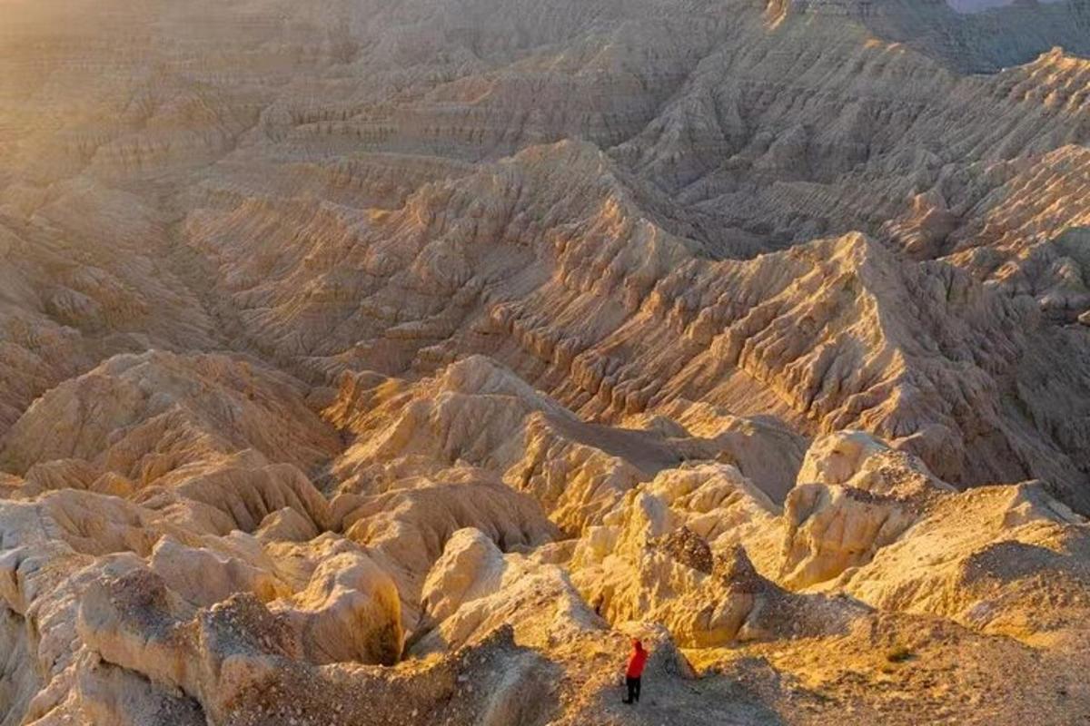 a person standing on top of a rocky mountain