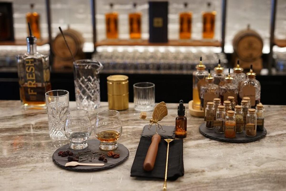 a table with bottles of whiskey and glasses on it