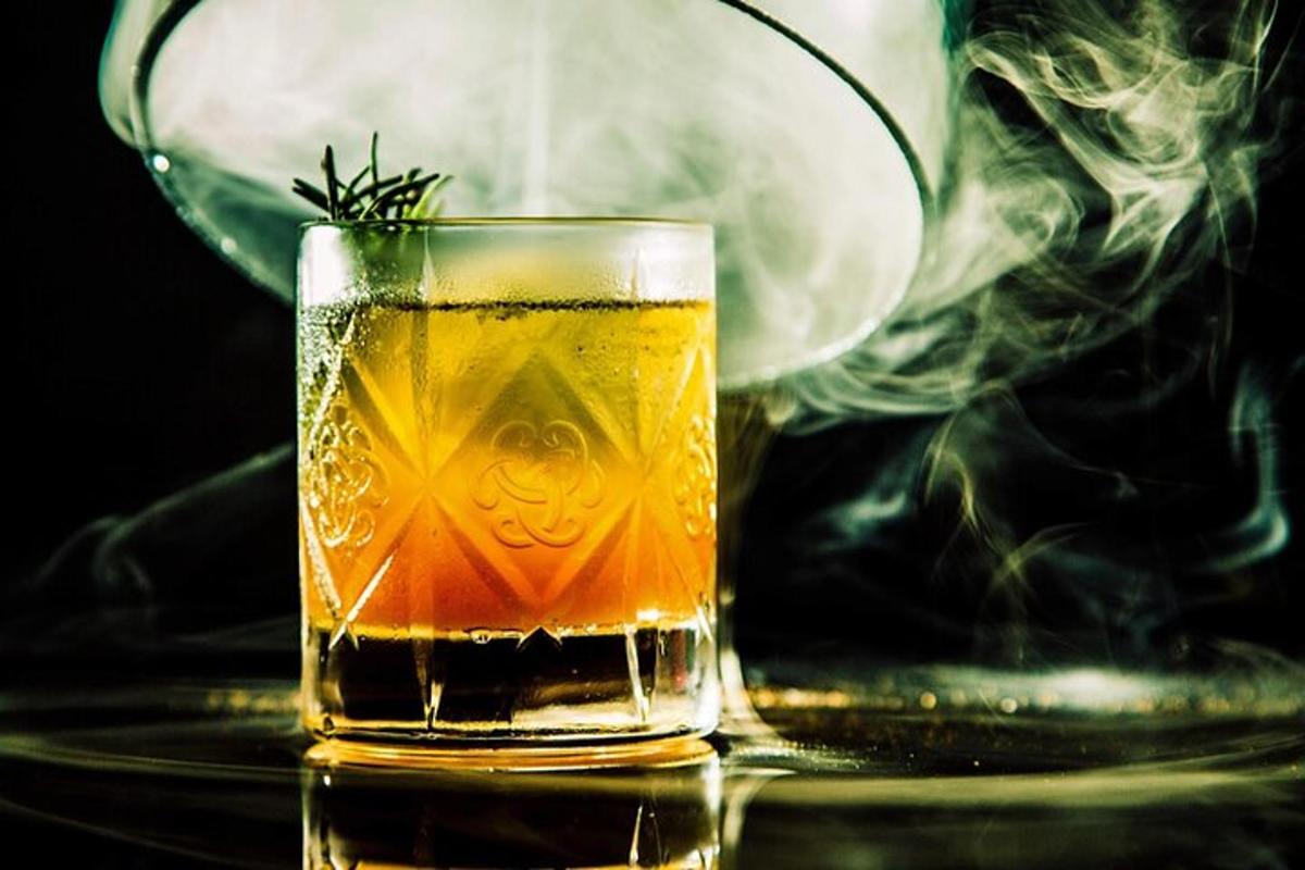 a glass of tea with smoke coming out of it