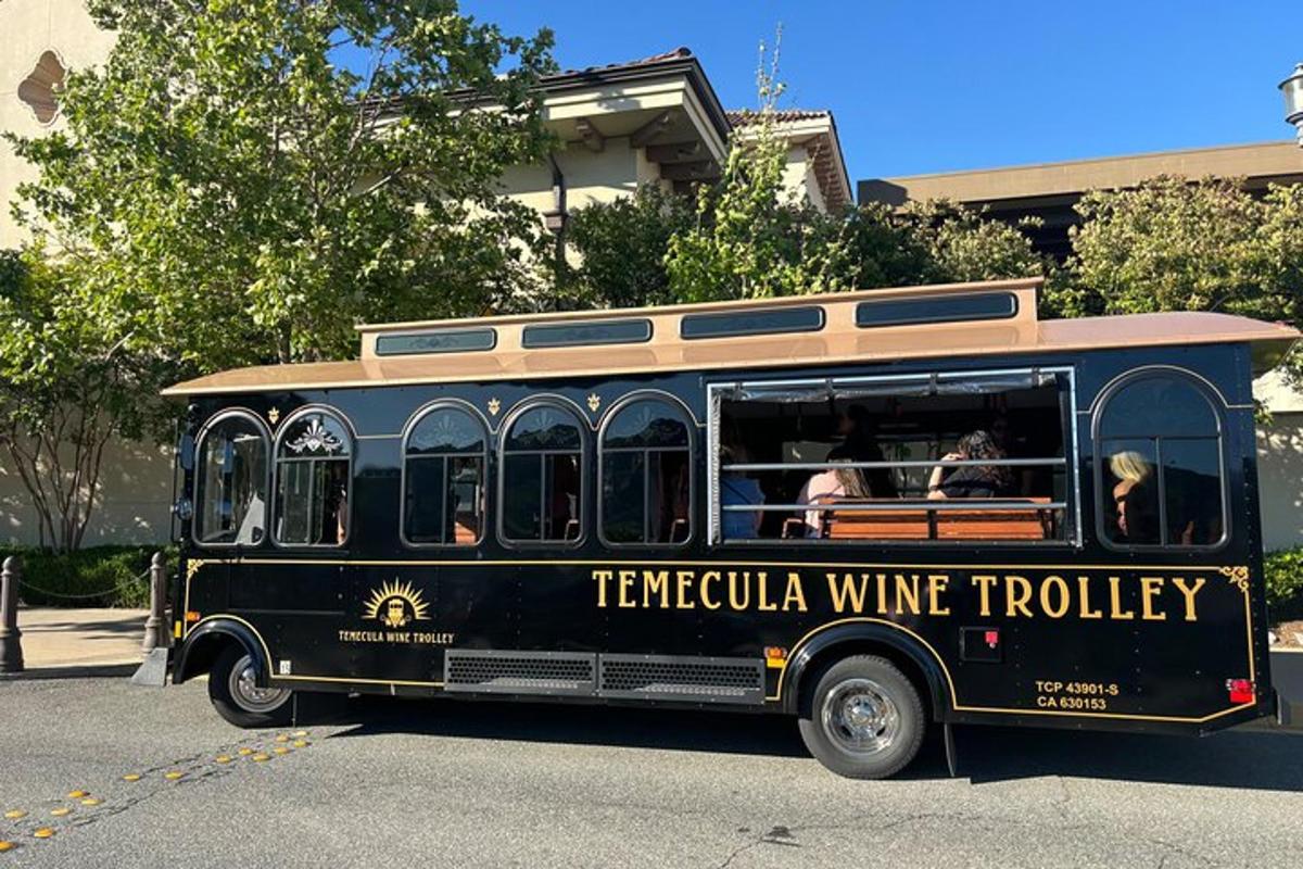 a black tampa wine truck parked on the street