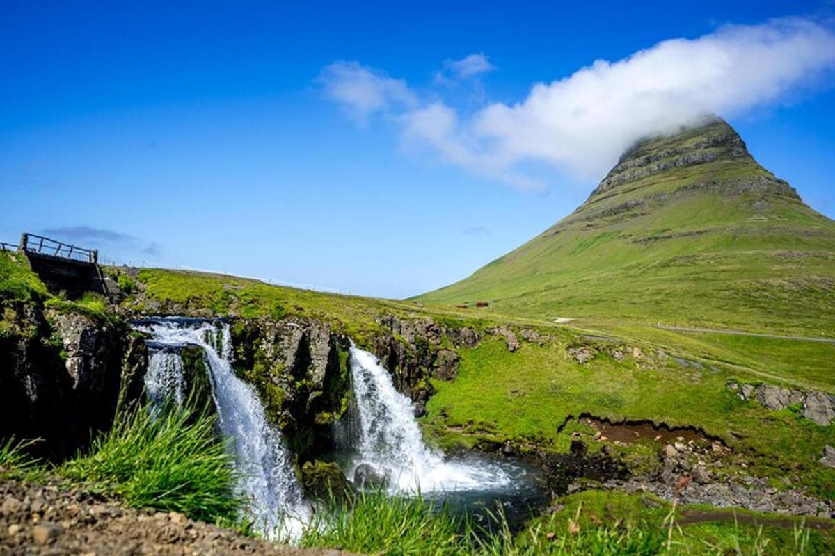 a waterfall on the side of a mountain