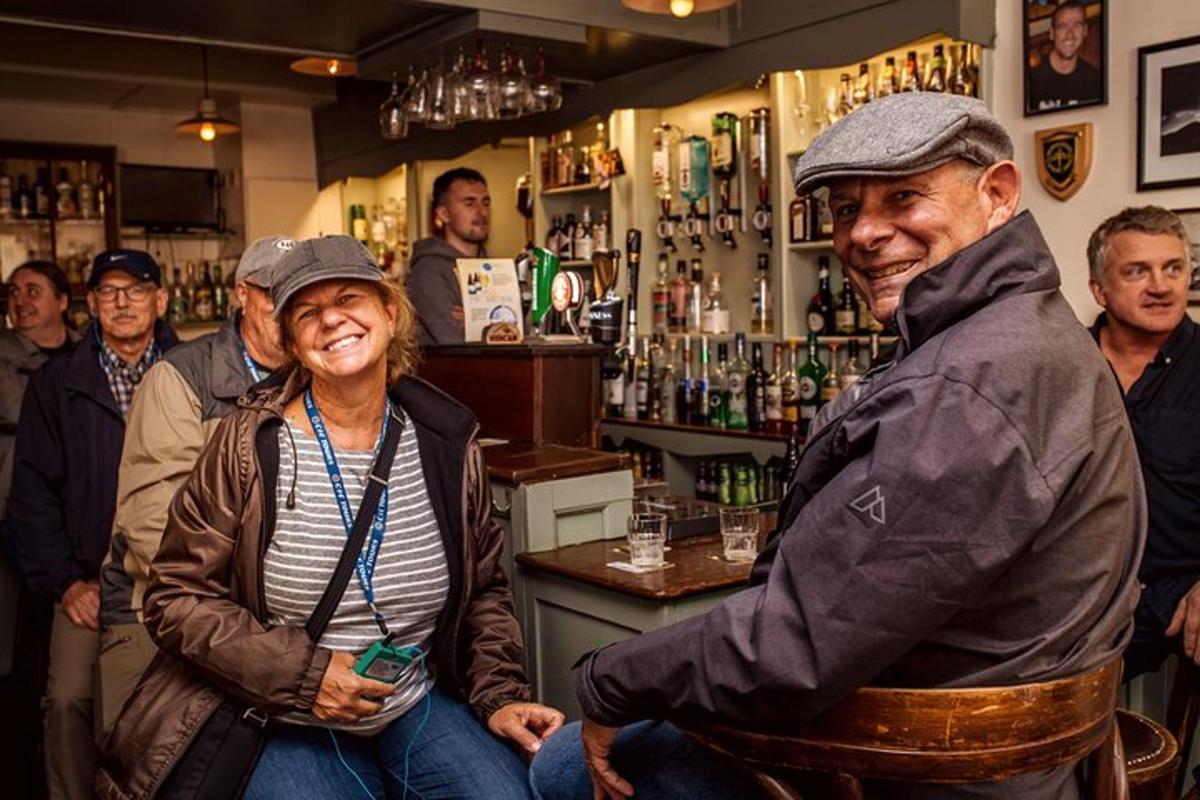 a group of people standing in a bar