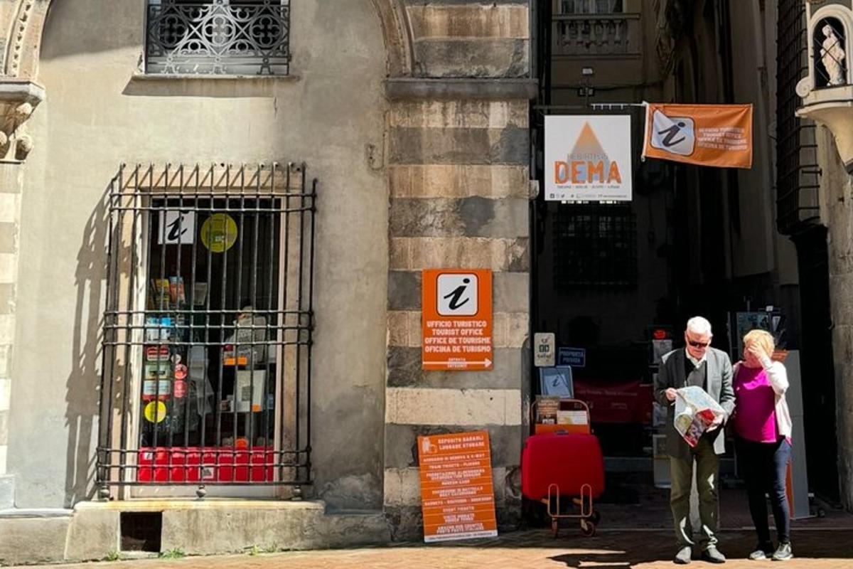 a man and a woman standing outside of a building