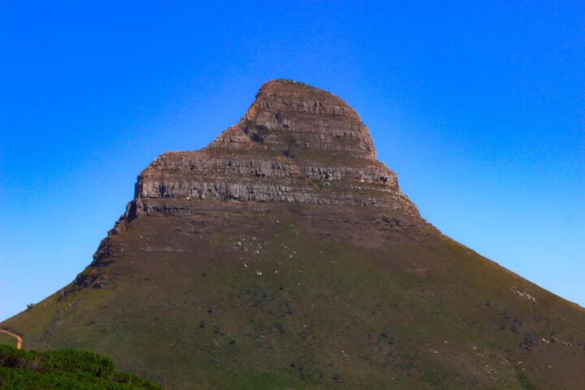 a large stone pyramid on top of a hill