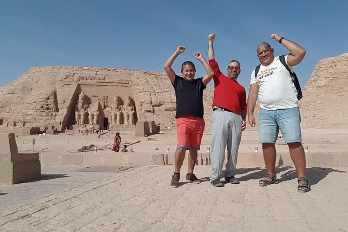 three people standing in front