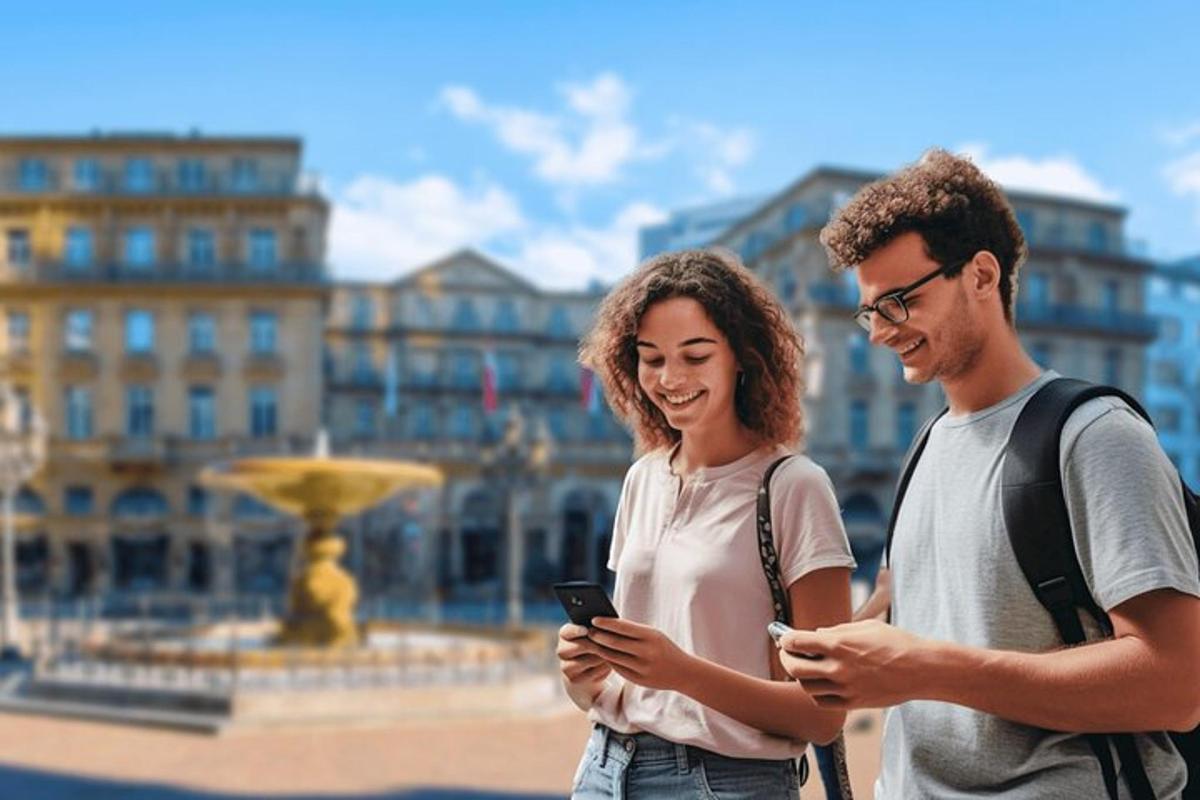 a man and a woman looking at their cell phones