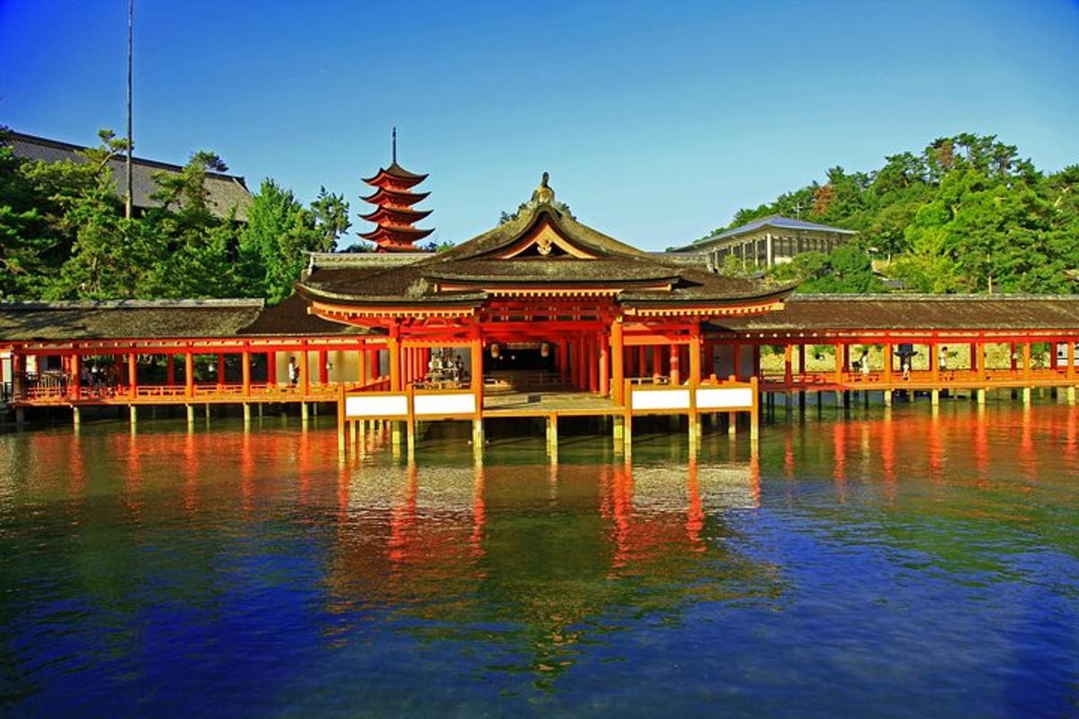 a building on a body of water with its reflection