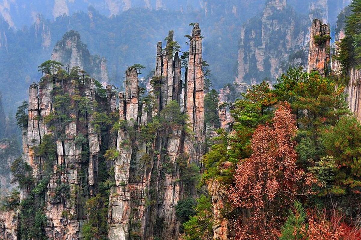 a rocky mountain with trees on top of it