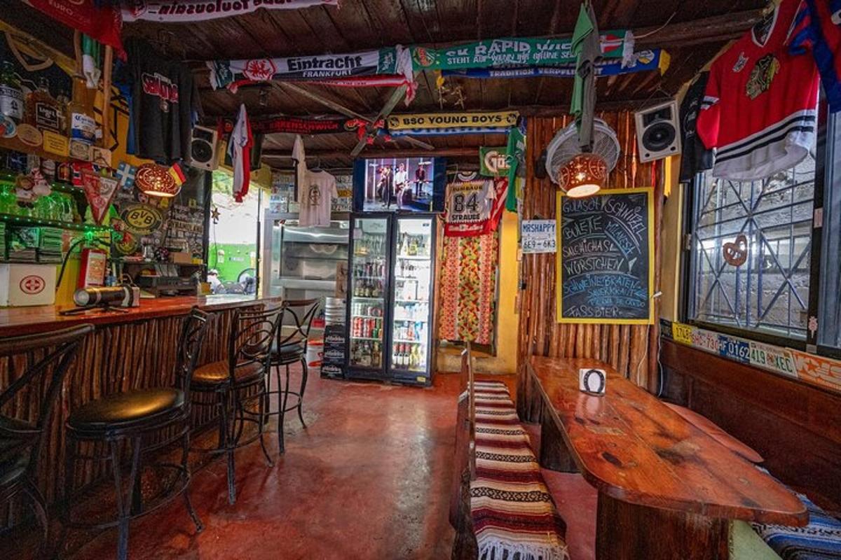 a bar with wooden tables and chairs in a room