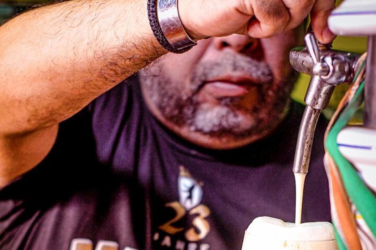 a man using a pair of scissors to cut a object