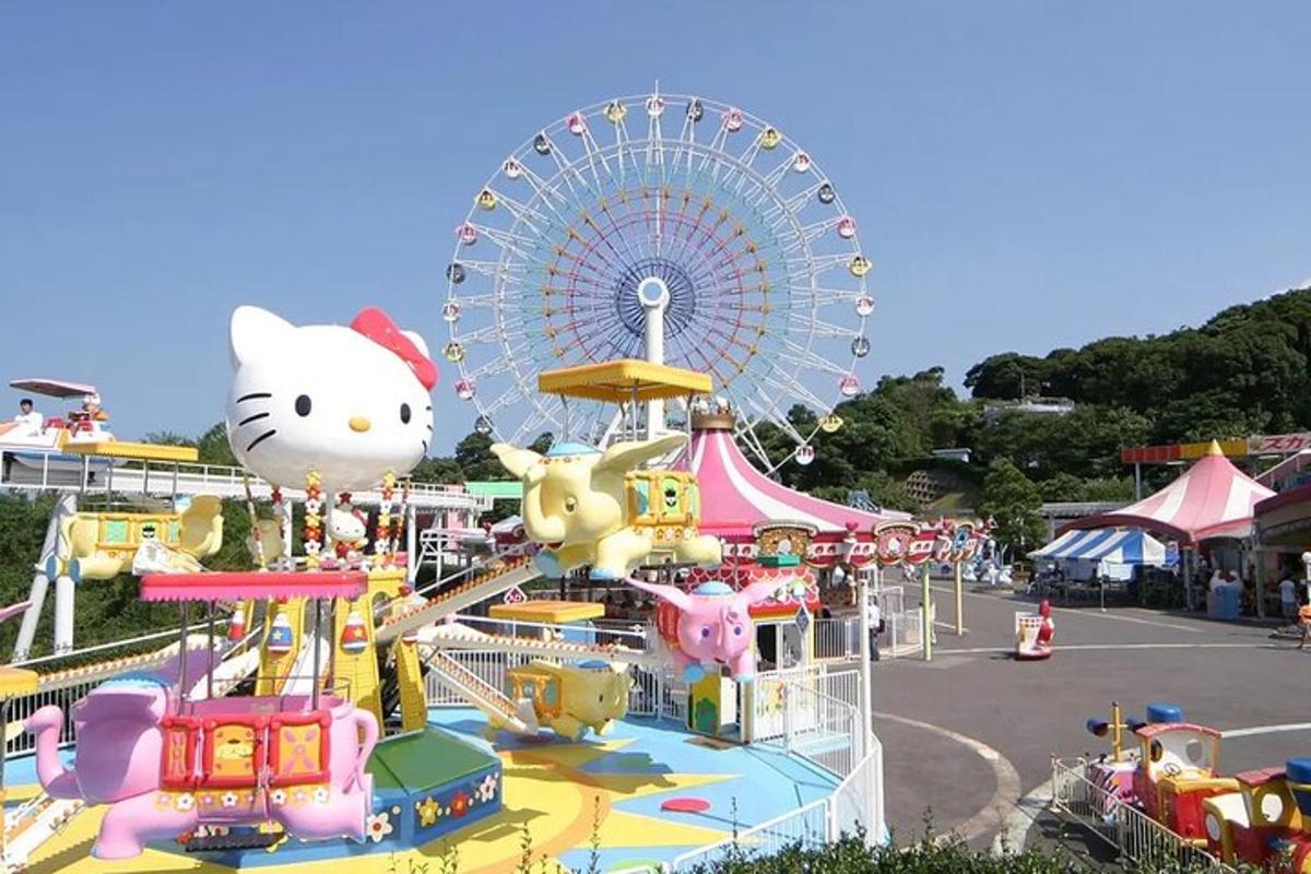 a carnival with a ferris wheel in the background