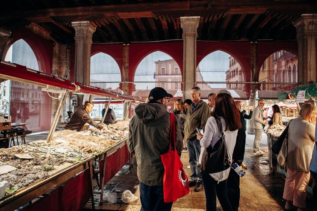 a group of people walking around a market