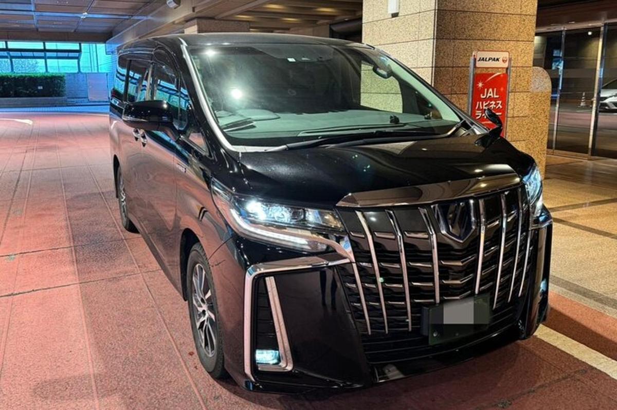 a black car parked in a parking garage