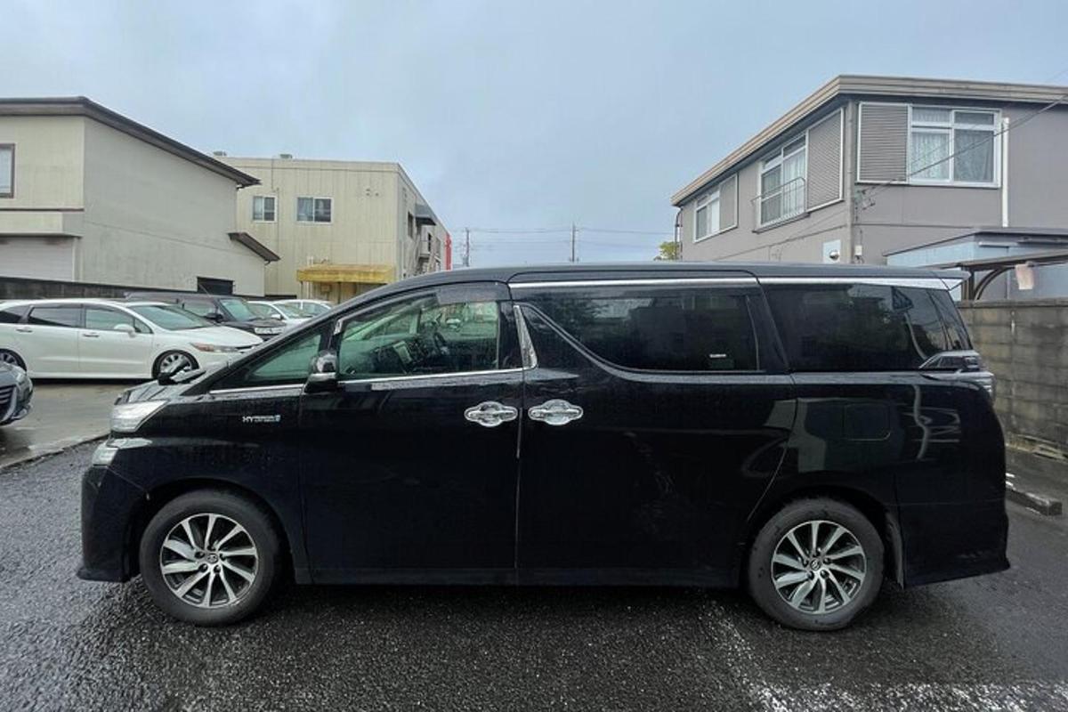 a black car parked in a parking lot