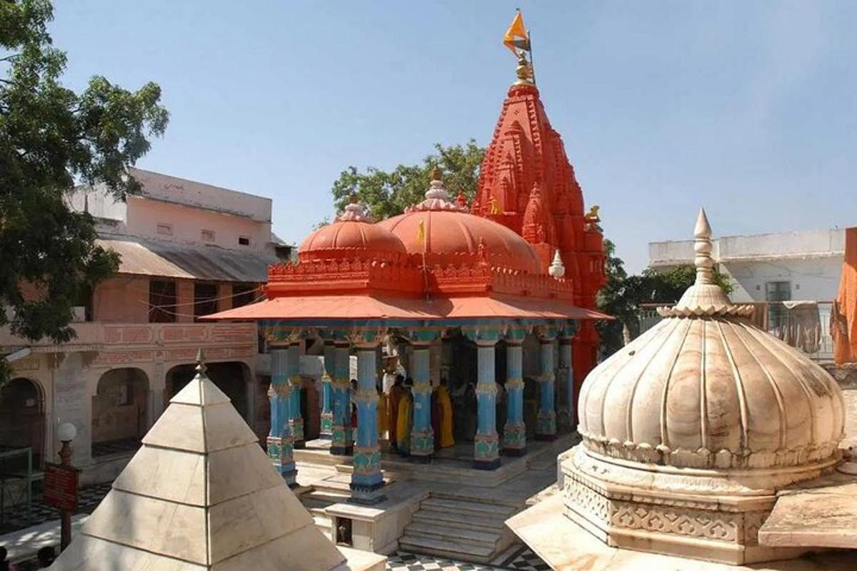a group of buildings with red domes on top