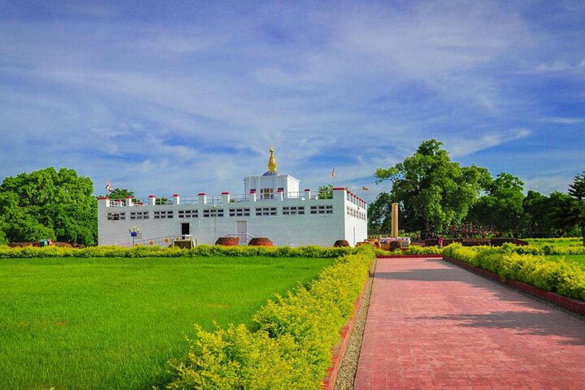 a large white building with a gold dome on top