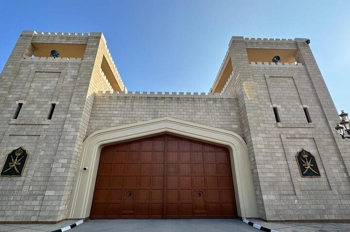 a large brick building with a brown garage door