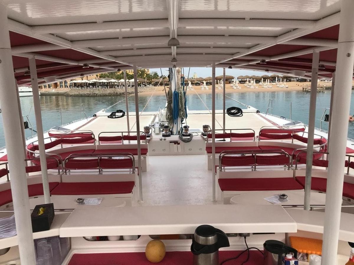 a boat with red seats on the water