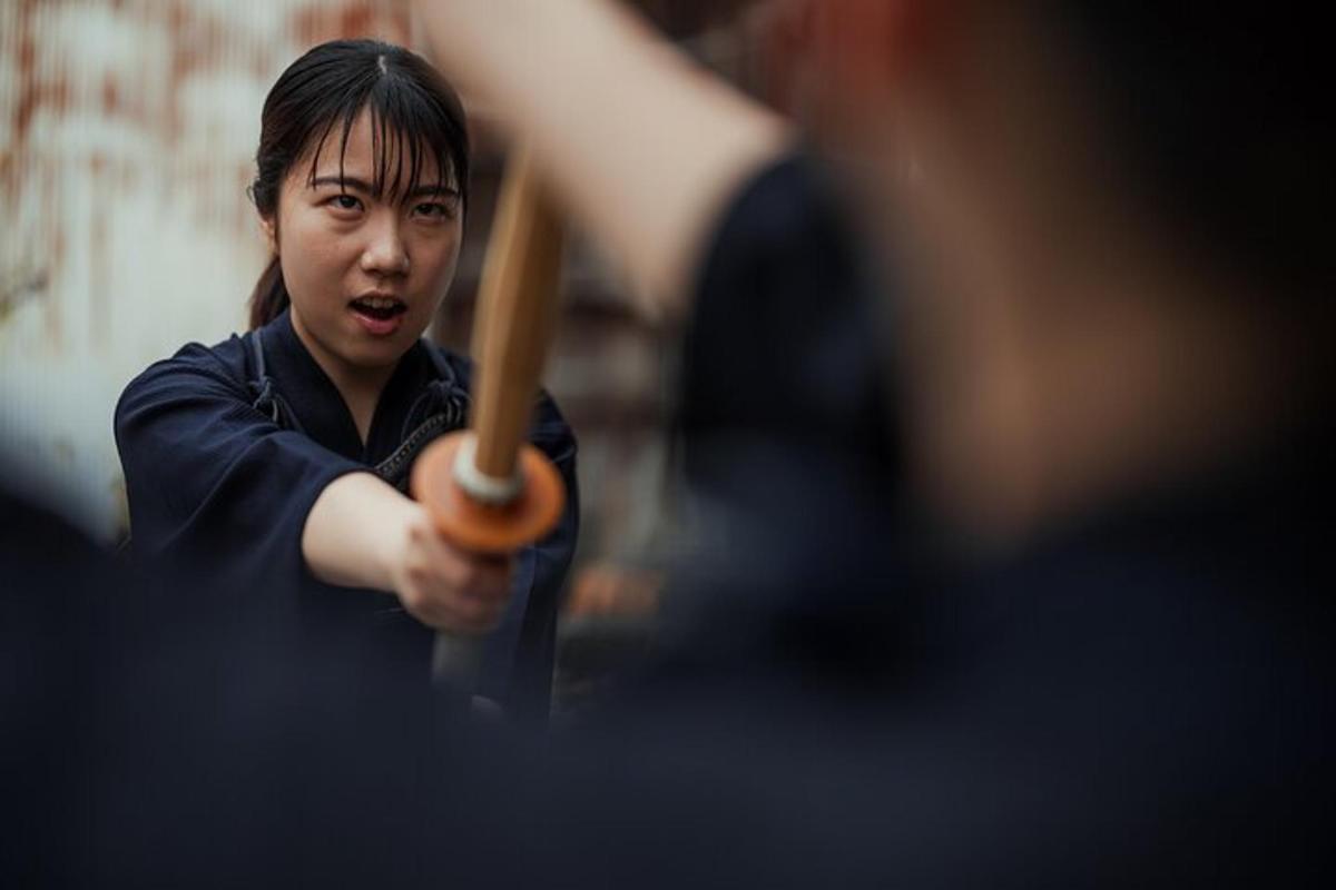 a woman holding a baseball bat in her hand