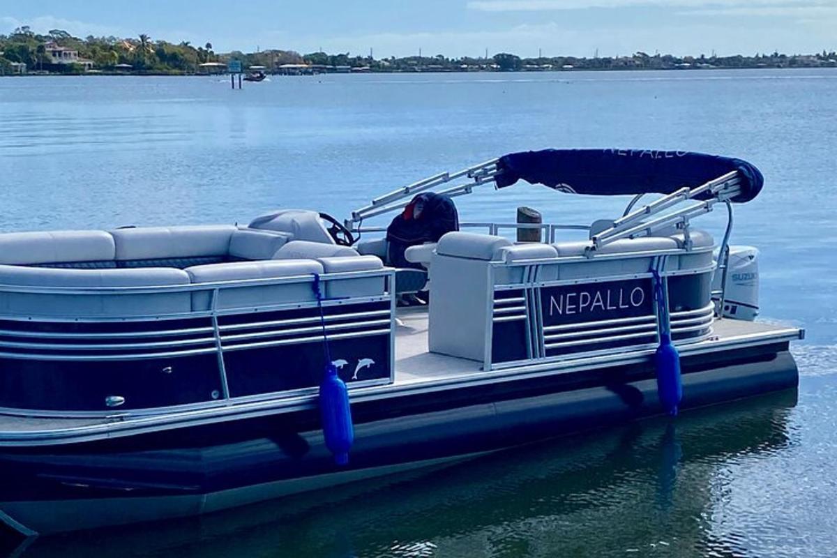 a pontoon boat sitting in the water